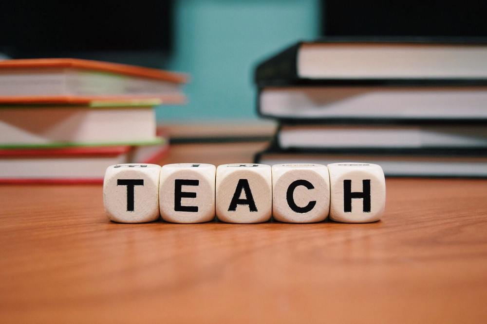 Blocks with letters spelling TEACH