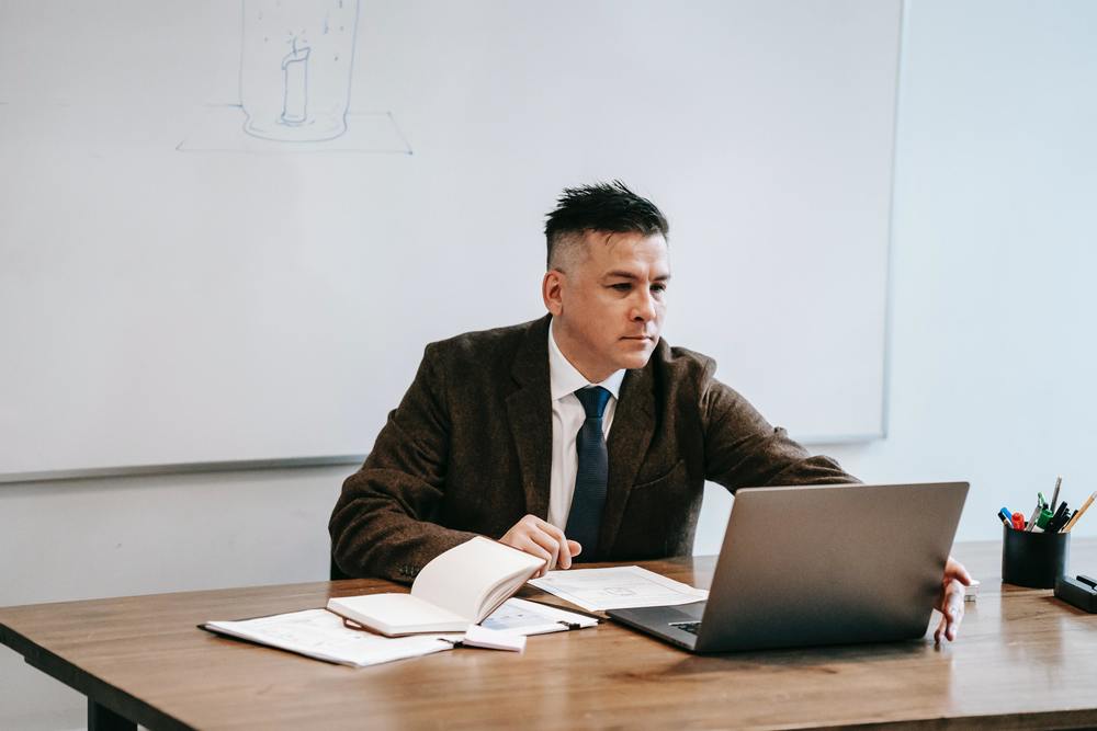 Teacher working on a laptop